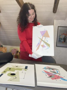 Artist Inta Leora with her limited edition Art print Collection Connections